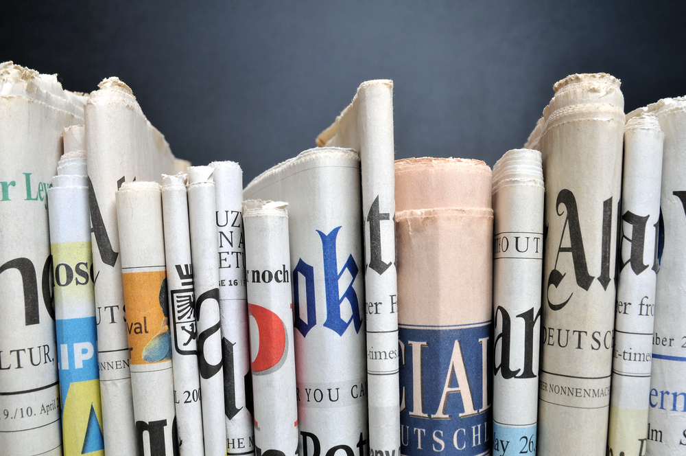 Newspapers stacked horizontally